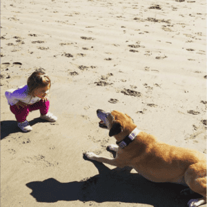 Mila Markowitz with her sister on the beach.